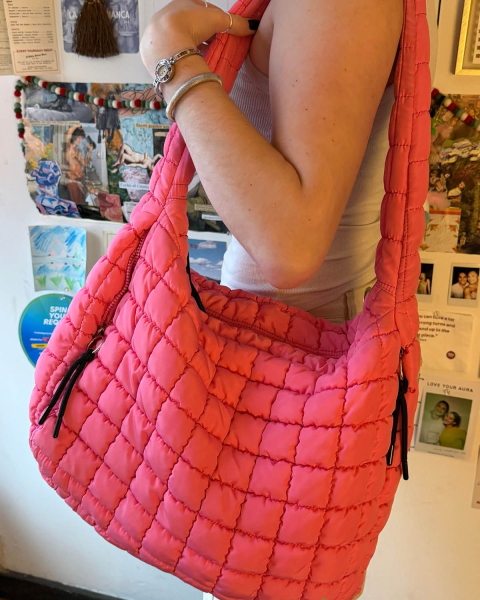 Katie Gunderman holding free people puffy carry all bag in bubblegum