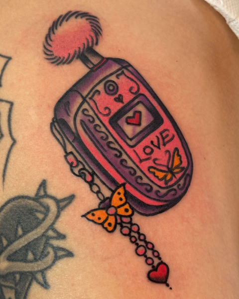 2026 tattoo trends  NOSTALGIC THEMES  flip phone tattoo
