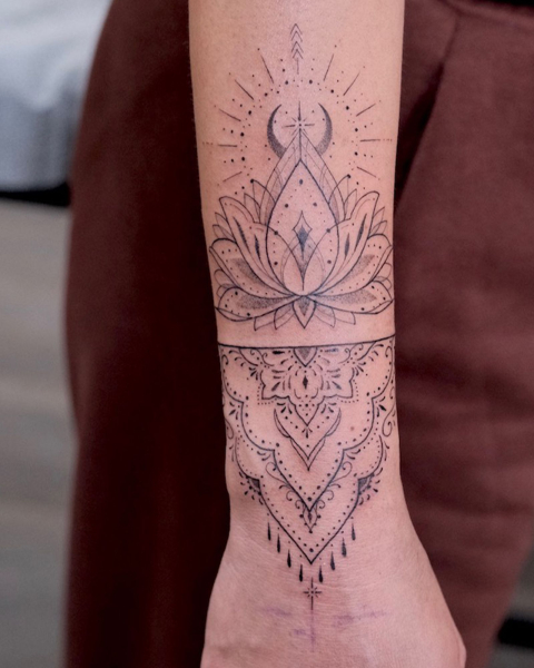 ornamental tattoo of lotus on wrist